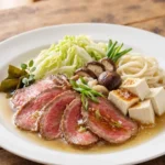 Shabu-Shabu – a Japanese dish where thin slices of meat and vegetables are briefly cooked in hot broth right at the table and then dipped in sauces.